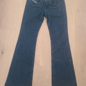 Diesel dark color jeans  with flare bottom.